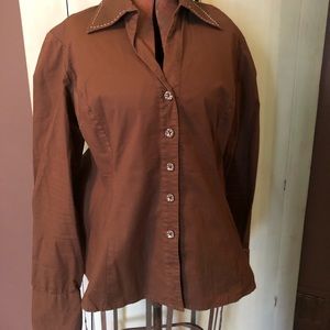 Brown blouse that is fitted and some fun detail